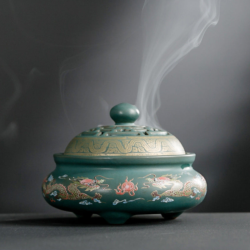 Hand-crafted cloisonne incense burner with rising smoke